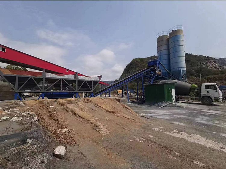JS series twin-shaft concrete mixer undergoing routine lubrication maintenance during the commissioning phase